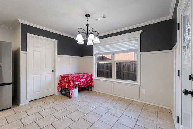 interior space with an inviting chandelier and ornamental molding