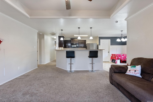 living room featuring light colored carpet, an inviting chandelier, and crown molding