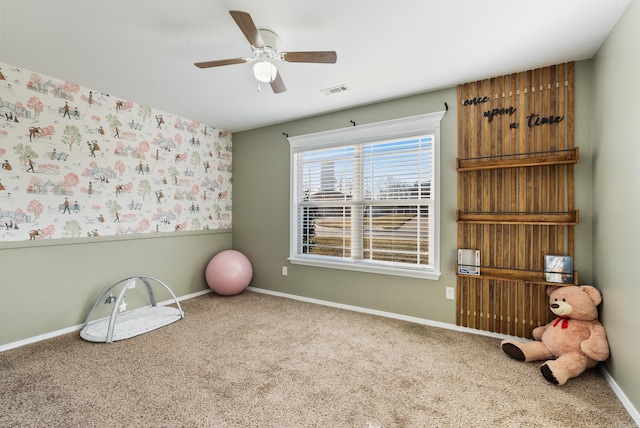 game room featuring carpet flooring and ceiling fan