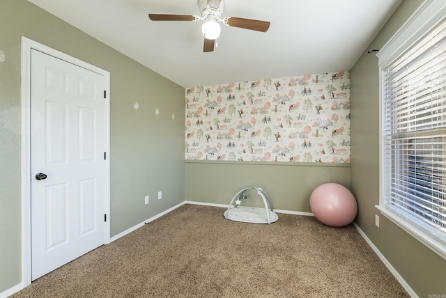 rec room with carpet and ceiling fan