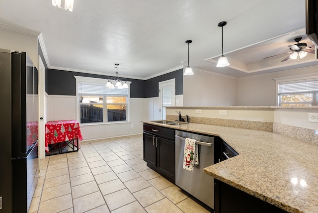 kitchen with pendant lighting, dishwasher, black refrigerator, crown molding, and sink