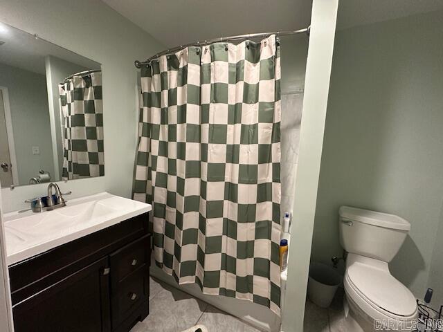 bathroom with tile patterned floors, vanity, toilet, and a shower with shower curtain