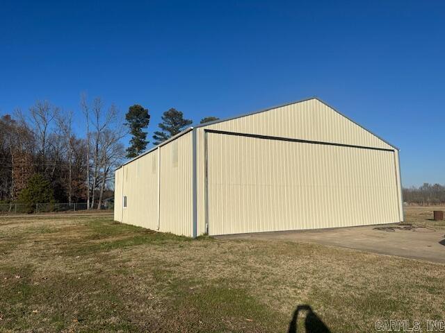 view of outbuilding with a lawn