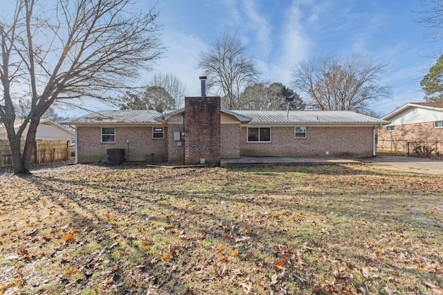 rear view of property featuring a patio area