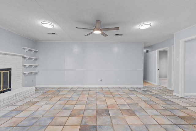 unfurnished living room with a fireplace, light tile patterned flooring, and a textured ceiling