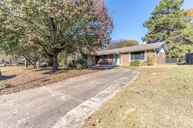 ranch-style home with a front yard