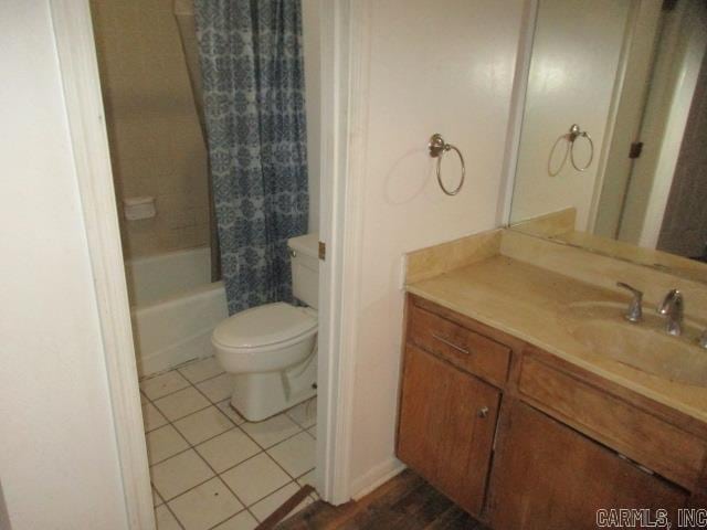 full bathroom with tile patterned flooring, vanity, toilet, and shower / bathtub combination with curtain