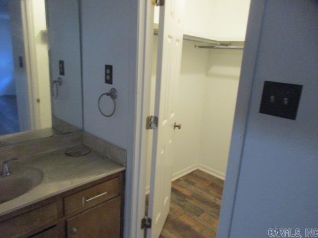 bathroom featuring vanity and hardwood / wood-style flooring