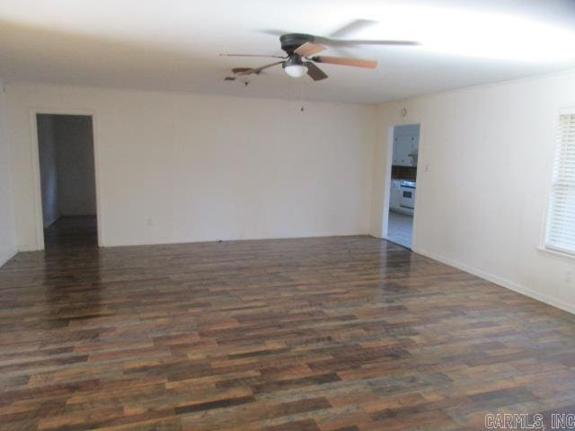 unfurnished room with dark hardwood / wood-style flooring