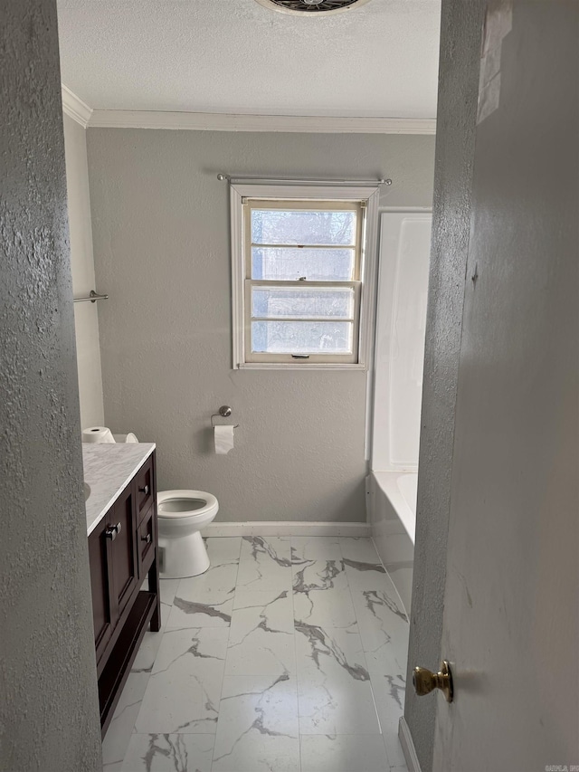 bathroom featuring vanity, toilet, a textured ceiling, and crown molding