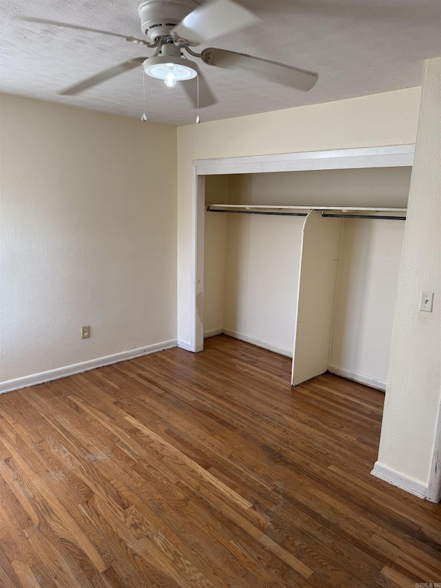 unfurnished bedroom with a closet, ceiling fan, and hardwood / wood-style floors