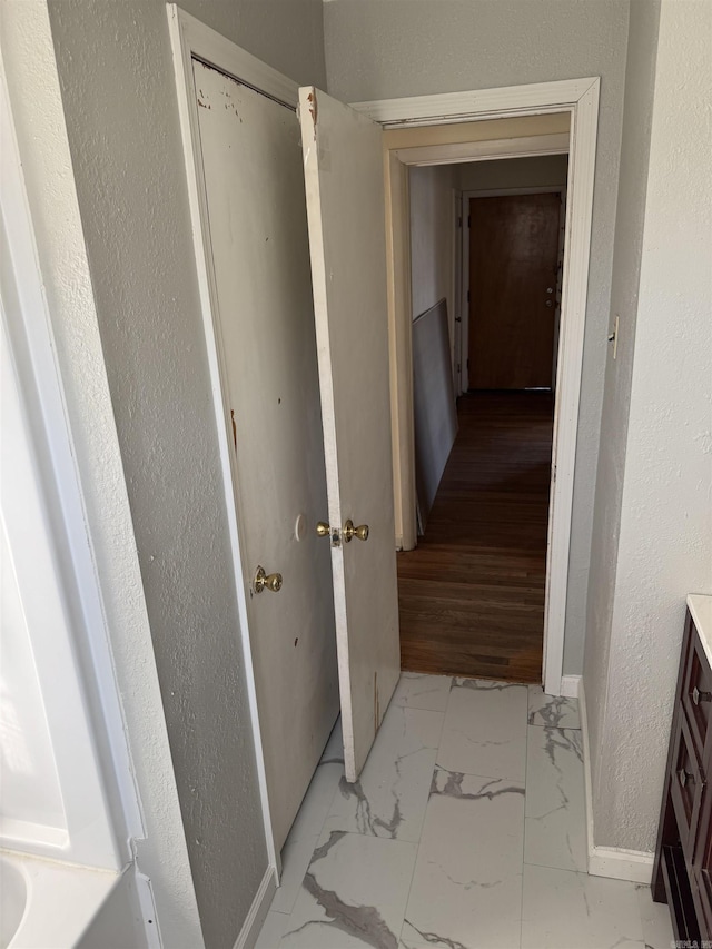 hallway with light wood-type flooring