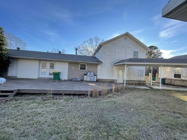 back of house with a yard and a wooden deck