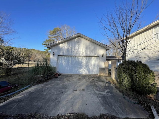 view of side of home with a garage