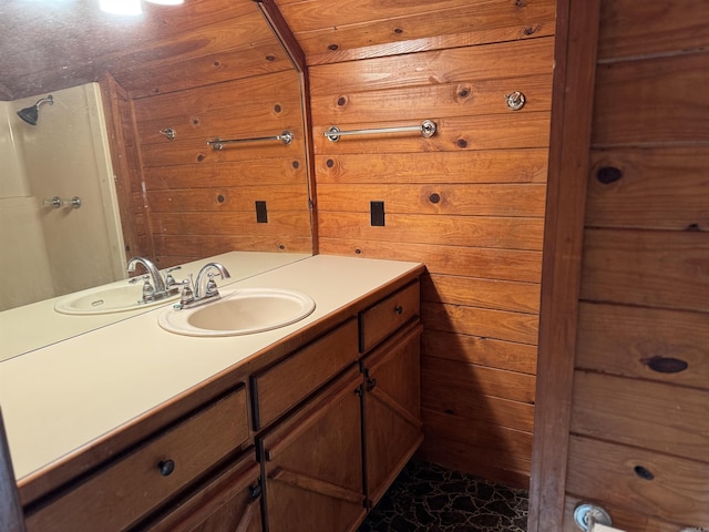 bathroom with vanity and wooden walls