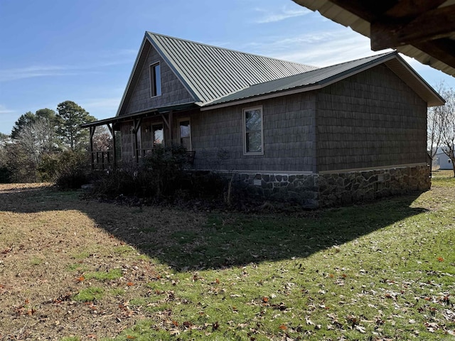 view of property exterior with a lawn