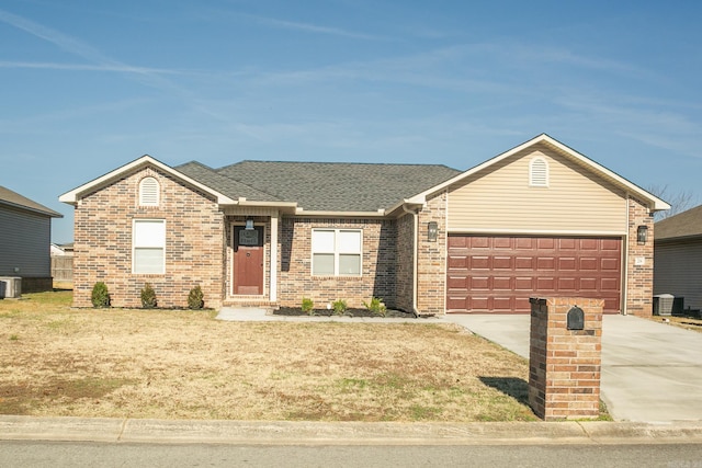 ranch-style home with central AC unit and a garage