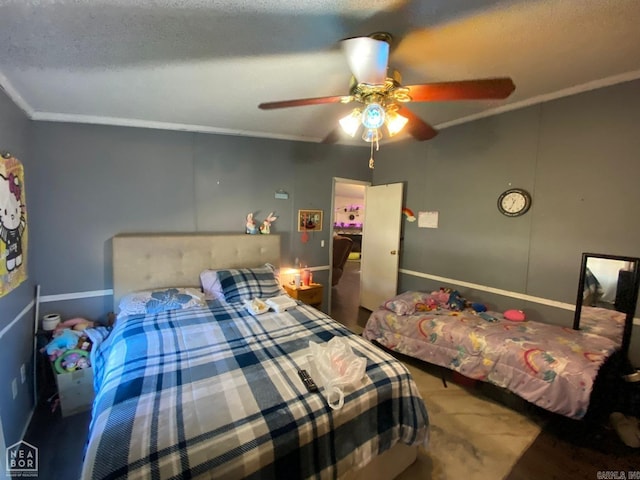 bedroom featuring a textured ceiling, ceiling fan, and ornamental molding