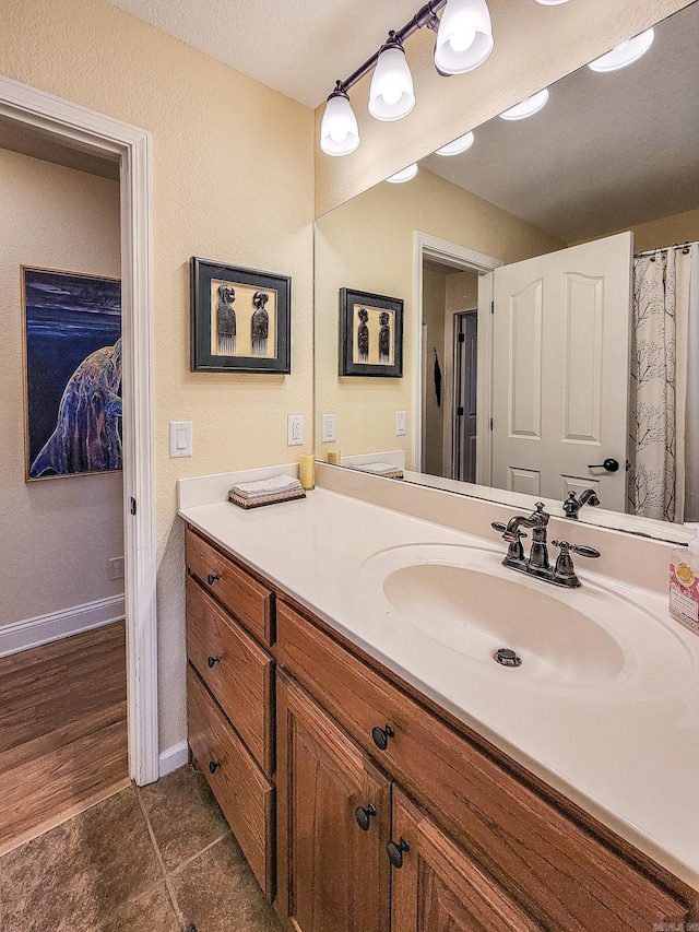 bathroom featuring hardwood / wood-style floors and vanity