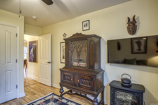 interior space featuring a textured ceiling and hardwood / wood-style flooring