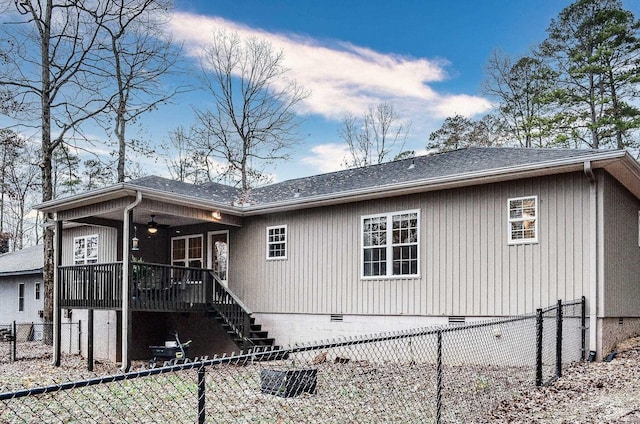 back of property with ceiling fan