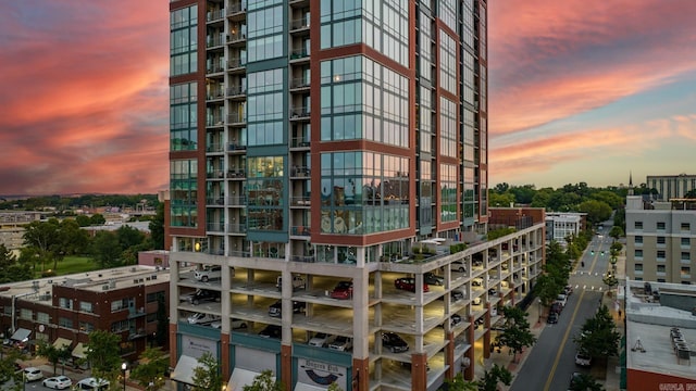 view of outdoor building at dusk