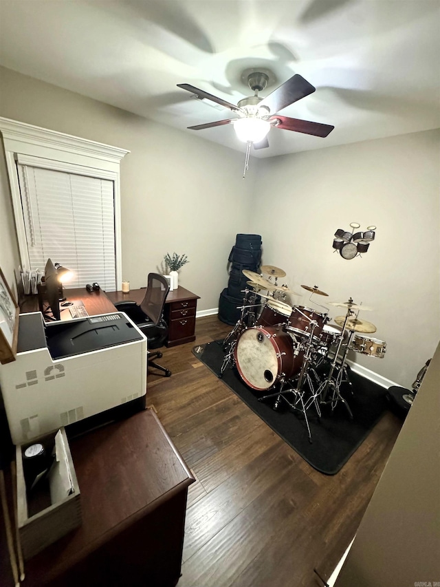 interior space featuring ceiling fan and dark hardwood / wood-style flooring