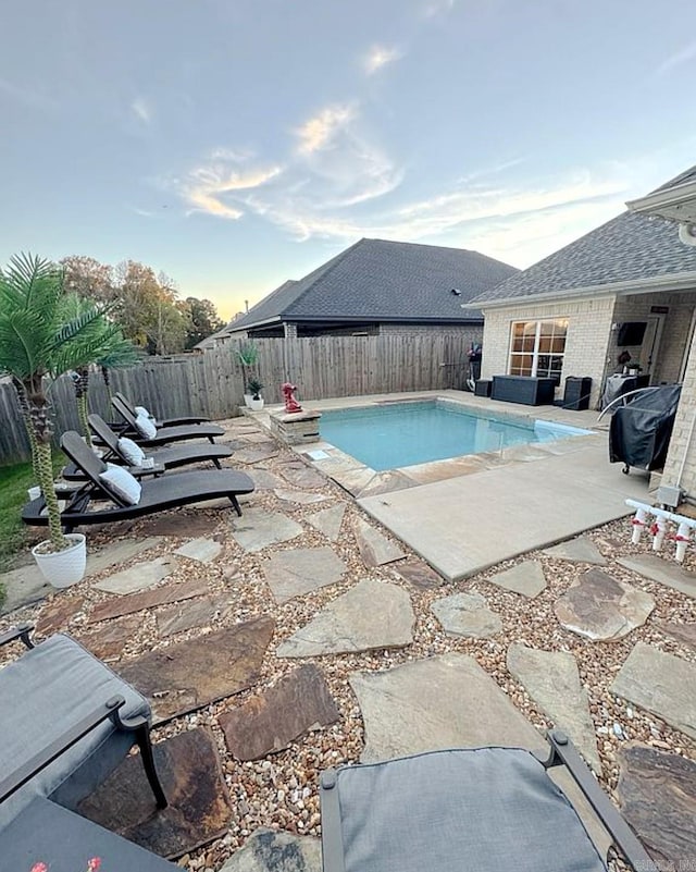 view of swimming pool with a patio