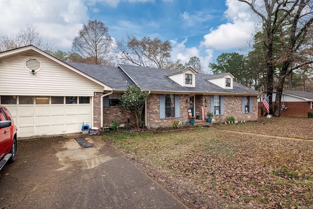 single story home with a garage and a front yard