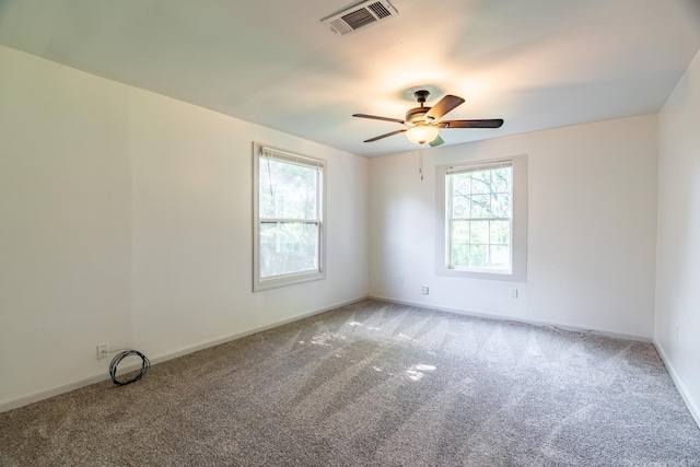 empty room with carpet and ceiling fan