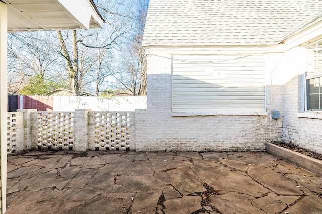 view of side of property featuring a patio