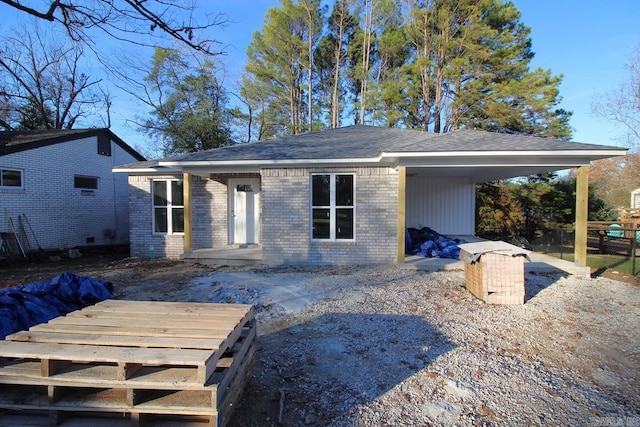 rear view of house with a carport