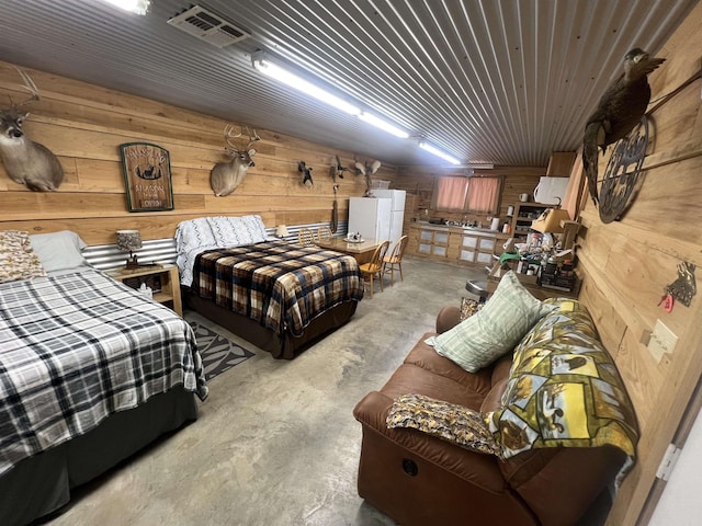 bedroom featuring wood walls