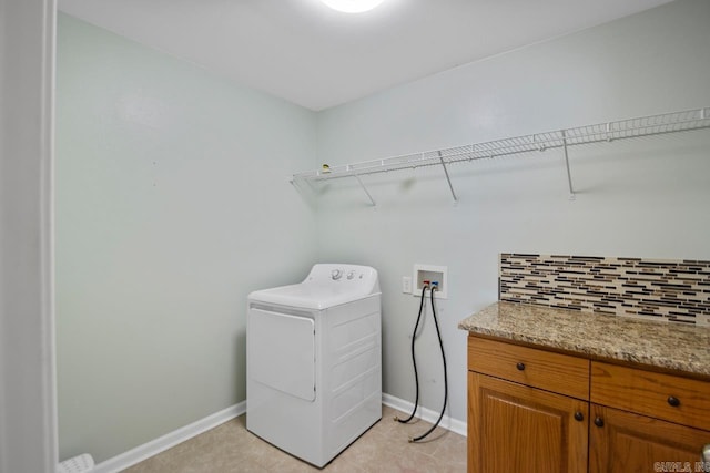 clothes washing area with washer / clothes dryer