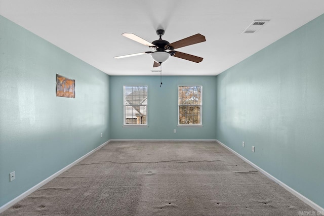 spare room featuring ceiling fan and light colored carpet