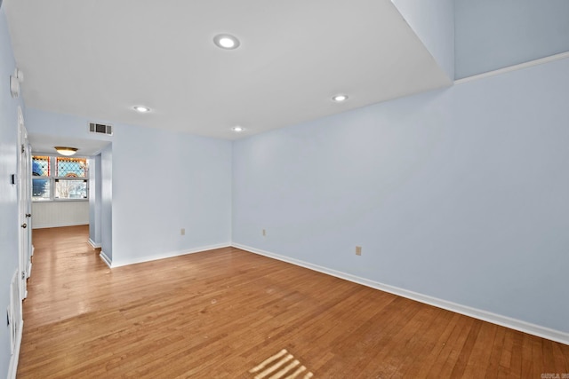 spare room featuring light wood-type flooring