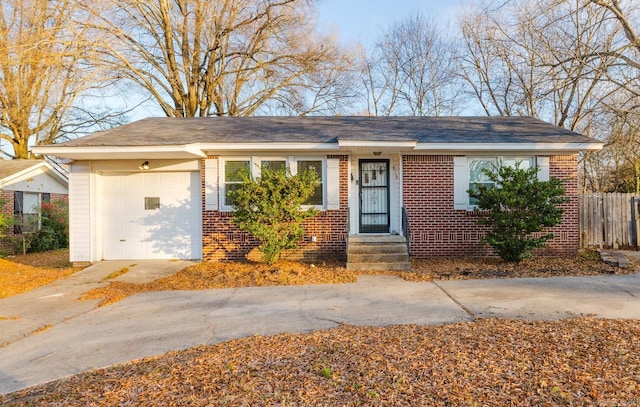 ranch-style house featuring a garage