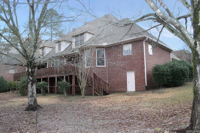 rear view of house with a wooden deck