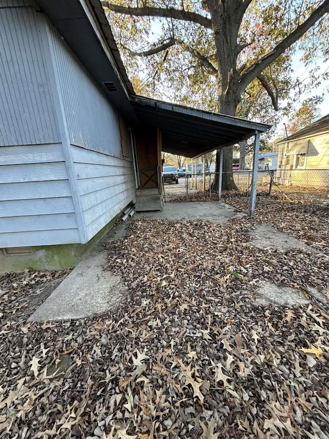 exterior space with a carport