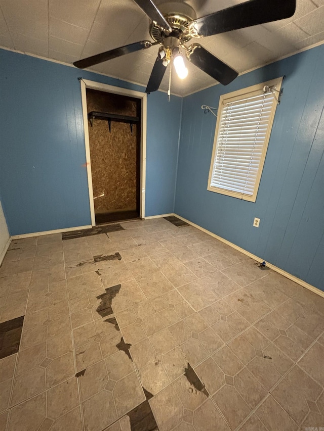 unfurnished bedroom featuring tile patterned floors, ceiling fan, a closet, and lofted ceiling with beams