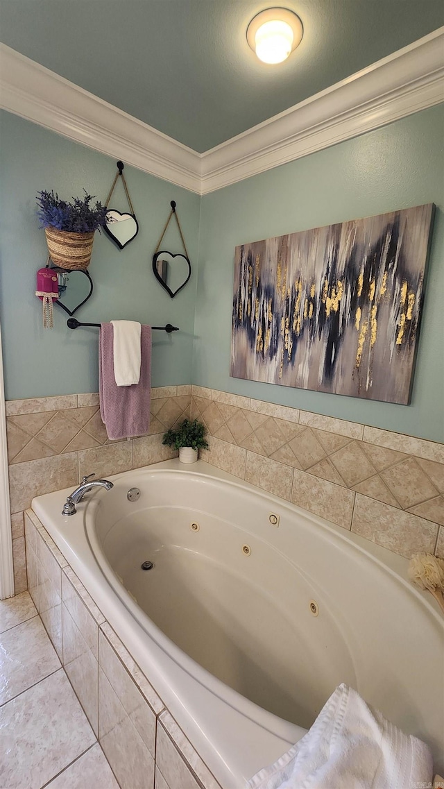 bathroom featuring tile patterned flooring, crown molding, and tiled bath