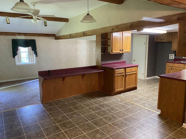 kitchen featuring dark colored carpet, lofted ceiling with beams, ceiling fan, tasteful backsplash, and decorative light fixtures