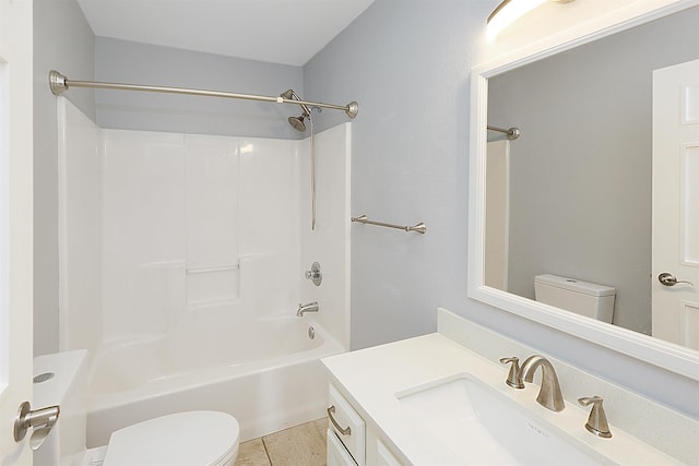 full bathroom with toilet, vanity, tile patterned floors, and tub / shower combination