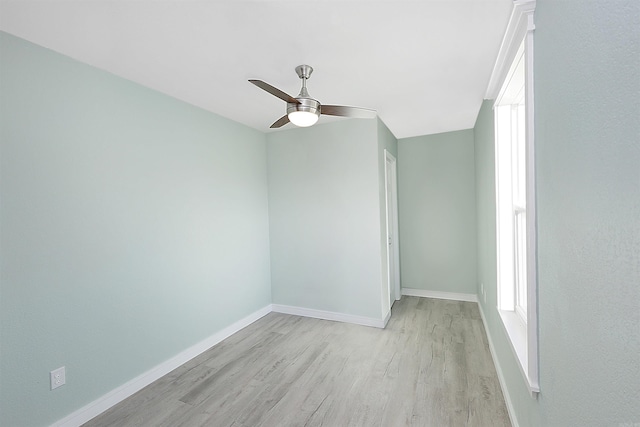 unfurnished room featuring light hardwood / wood-style flooring and ceiling fan