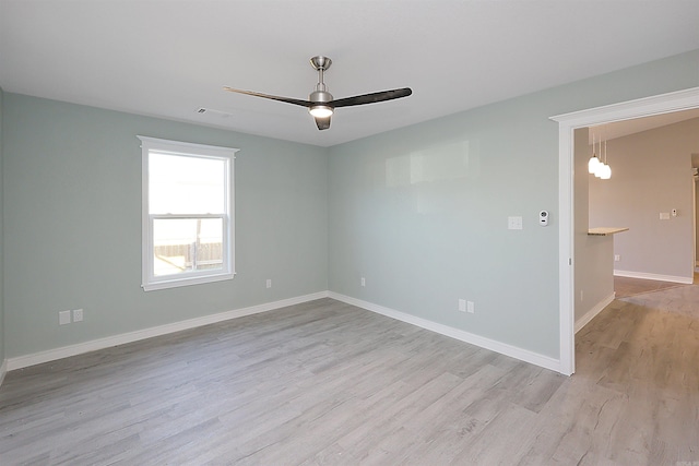 spare room with ceiling fan and light hardwood / wood-style flooring