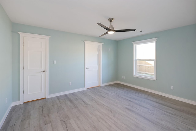 unfurnished bedroom featuring ceiling fan and light hardwood / wood-style floors