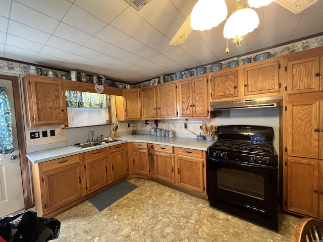 kitchen featuring ceiling fan, black gas stove, and sink