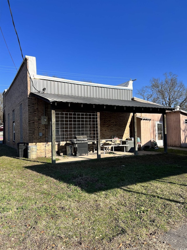 exterior space featuring a patio area and a yard