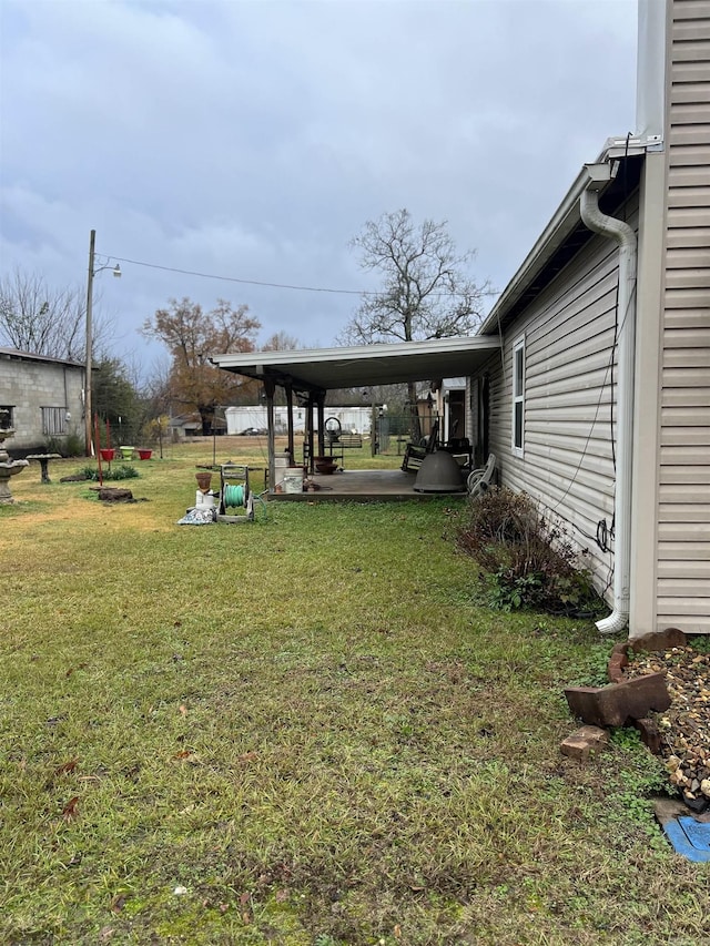 view of yard featuring a carport