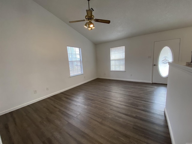 entryway with a textured ceiling, high vaulted ceiling, ceiling fan, and dark wood-type flooring